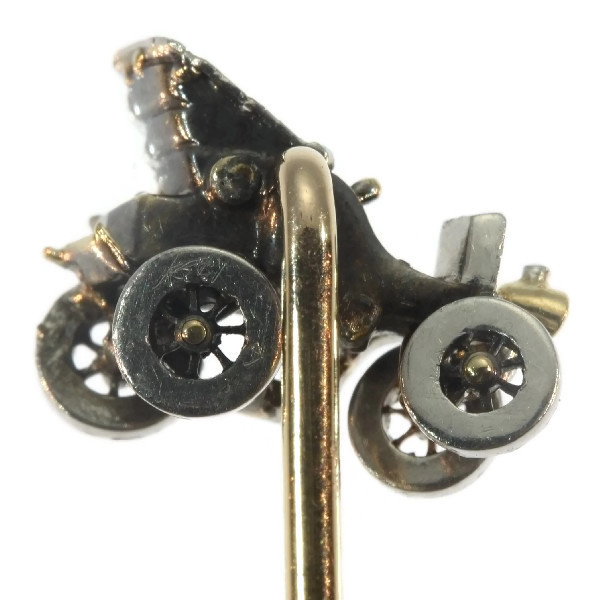 Antique bejeweled tiepin showing one of the first cars
